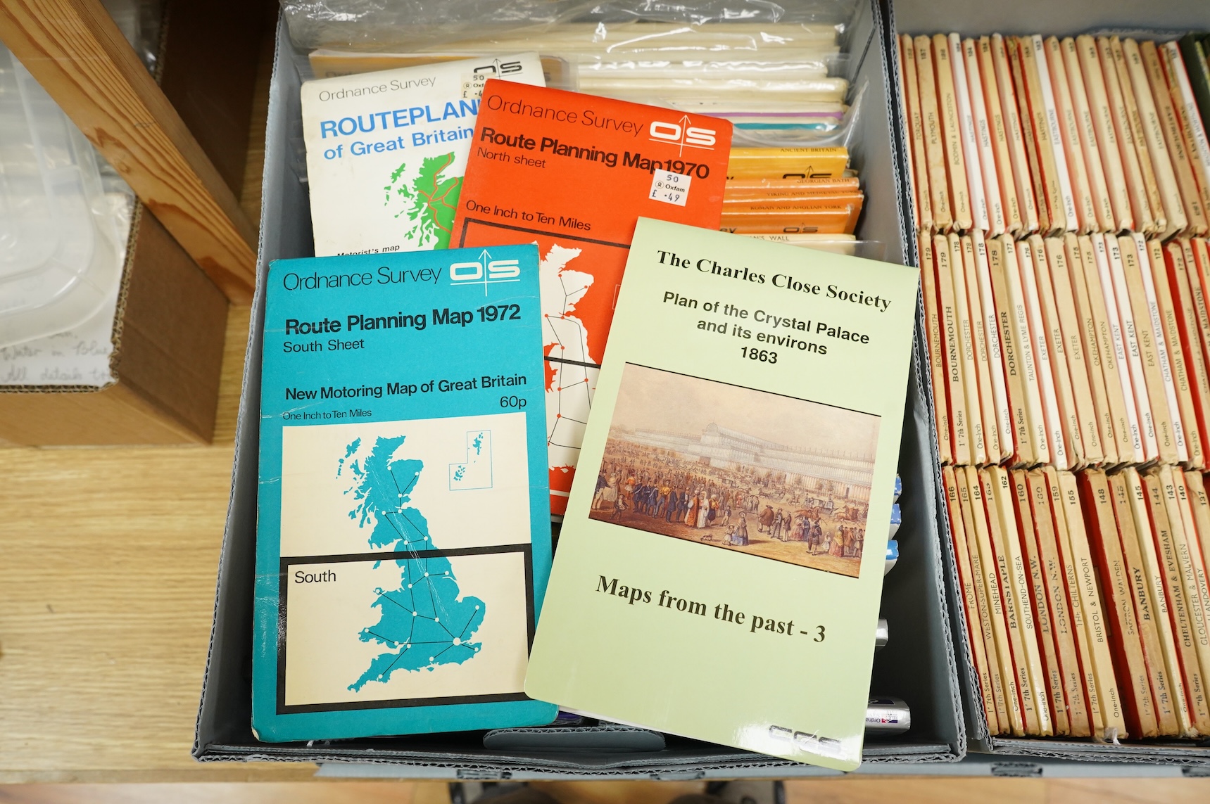 A collection of Ordnance Survey maps including Explorer series 1:25,000, Seventh Series One Inch, together with miscellaneous touring and historic editions (3 boxes)
